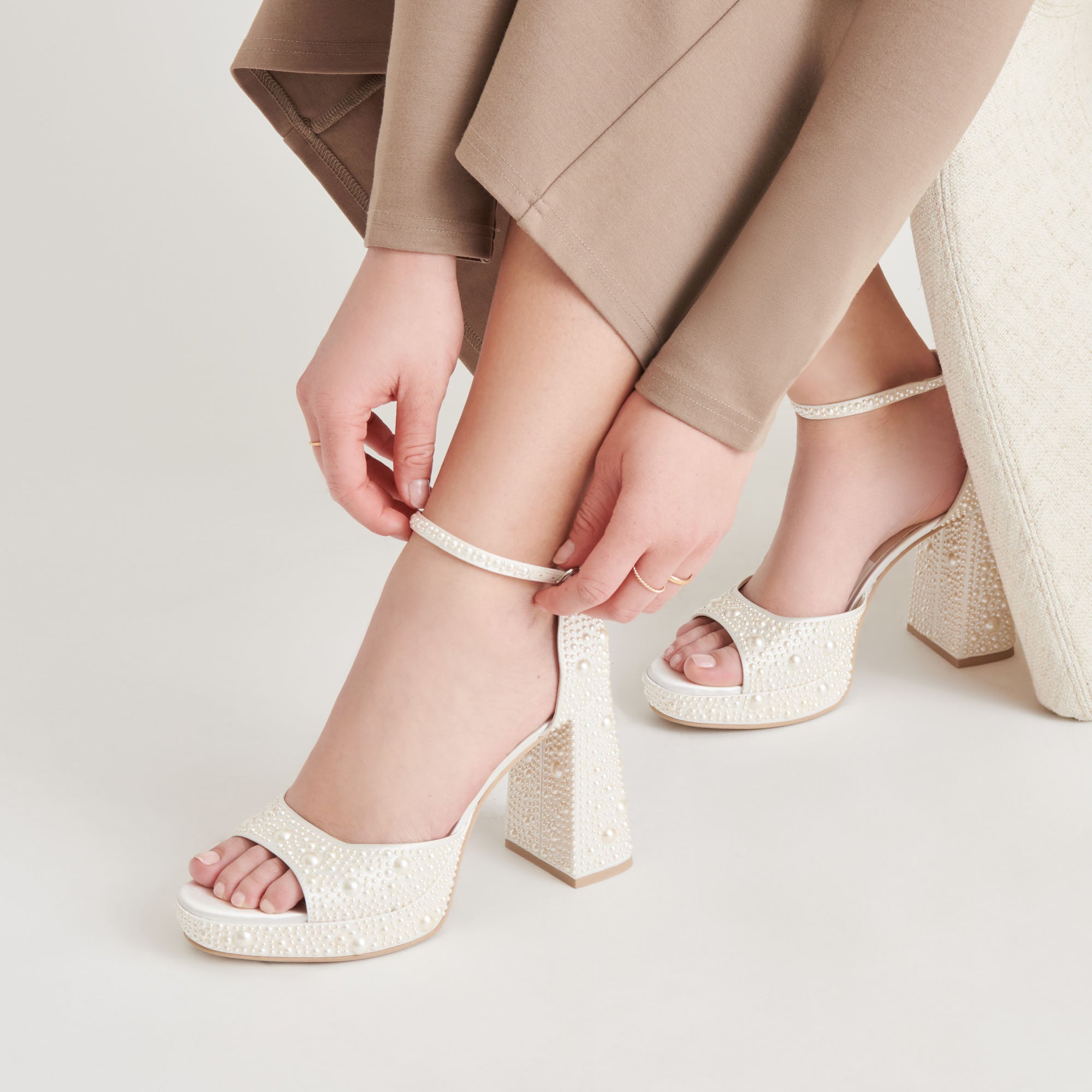 DOLCEVITA-HEELS_PANDROPEARL_TRUEWHITESATIN_ONFOOT_02-1_e19deecf-393c-4558-8525-9713a1c42ede-1.jpg